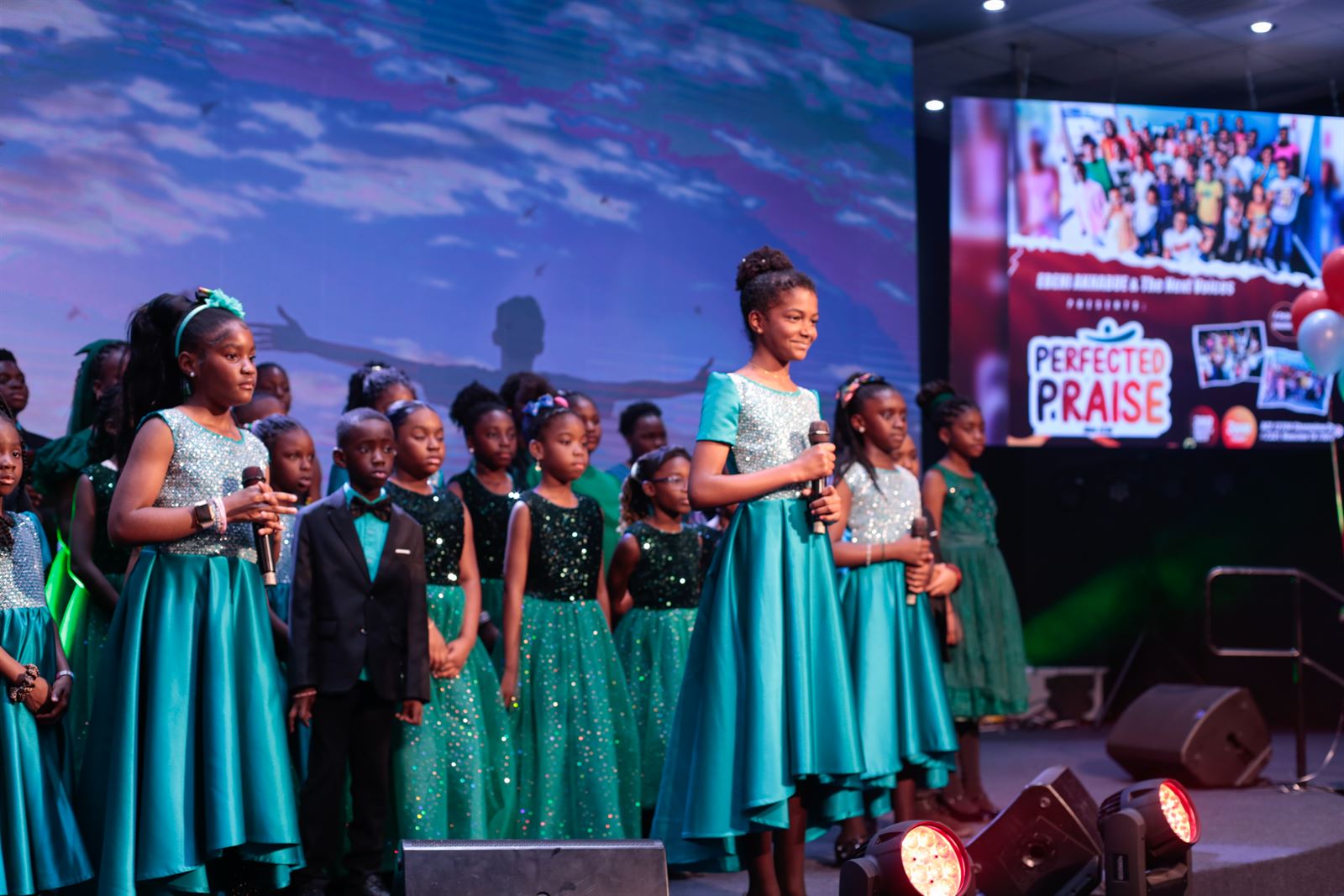 The girls' ensemble in shimmering teal